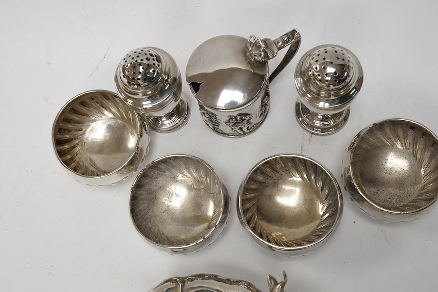 Assorted small silver including a cigarette case, set of four Victorian salts by Thomas Bradbury & Sons, London, 1878, a sterling cow creamer and three condiments. Condition - fair to good